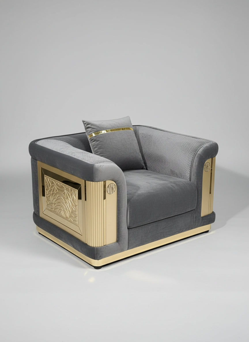 Gray upholstered chair with gold accents in a showroom setting
